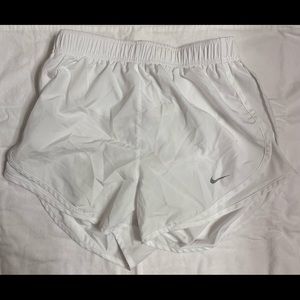 White Nike women’s running shorts.